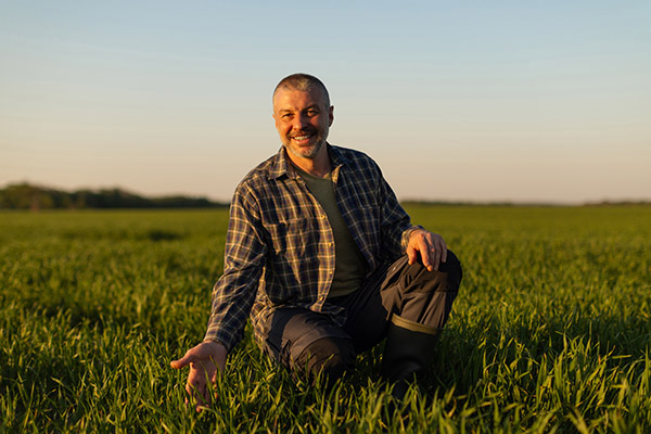 Person learning hands-on in a field